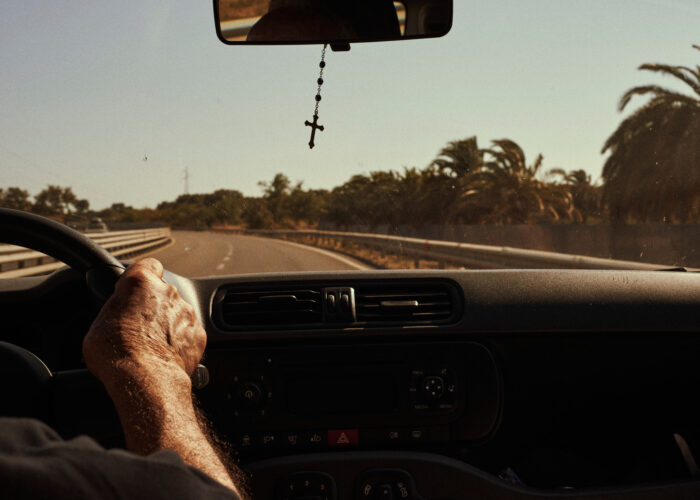 Travel photograph of a road in Sardinia seen from the driver's view