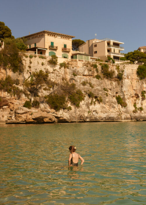 Travel landscape of cliffside houses above the sea.
